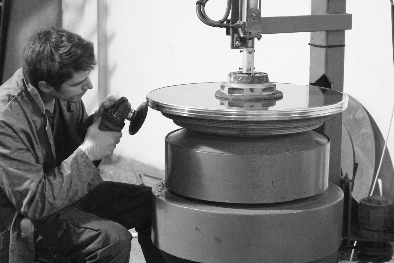 Man sanding on metal surface in grayscale updraft pre smush original 1536x1025